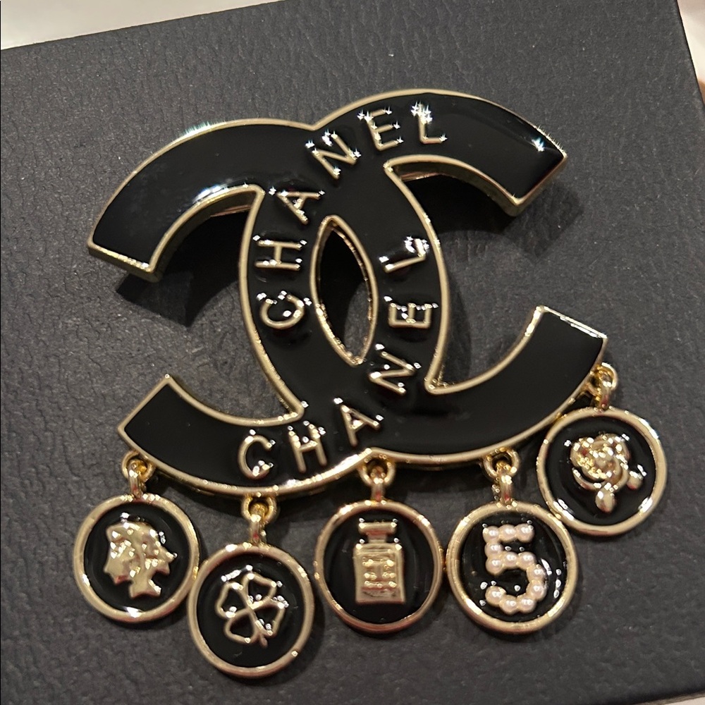 CHANELLY Black and Gold Charm Brooch